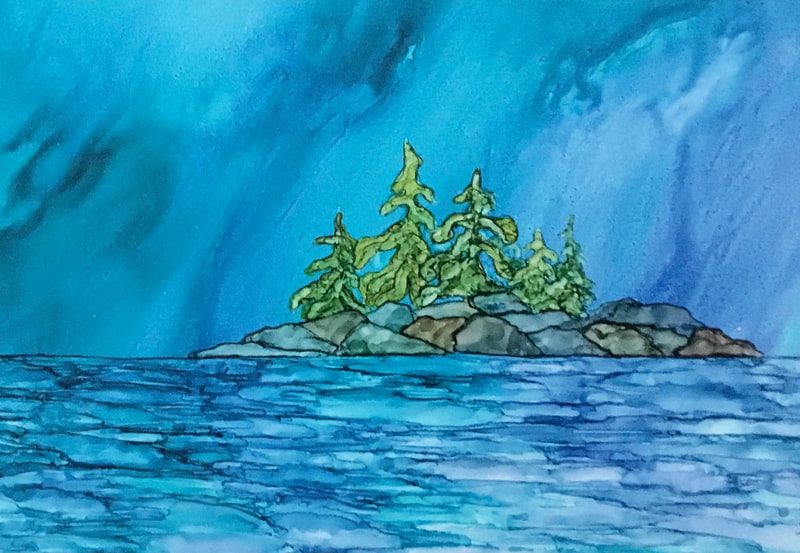Winnipeg Fine Art Fair invites Artist's to Apply Now. The link to apply overlays an image link. The image captures a rocky island with gently rolling boulders represented with muted natural hues. Atop the island is a crown of abstractly shaped Spruce trees in varying shades of emerald green. The sky and the water are saturated with teal ink that captures the rolling waves and a moody misting sky.